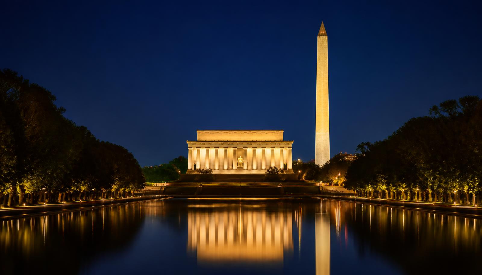 The Lincoln Memorial and Washington Monument floodlit at night, reflected in the Lincoln Memorial Reflecting Pool